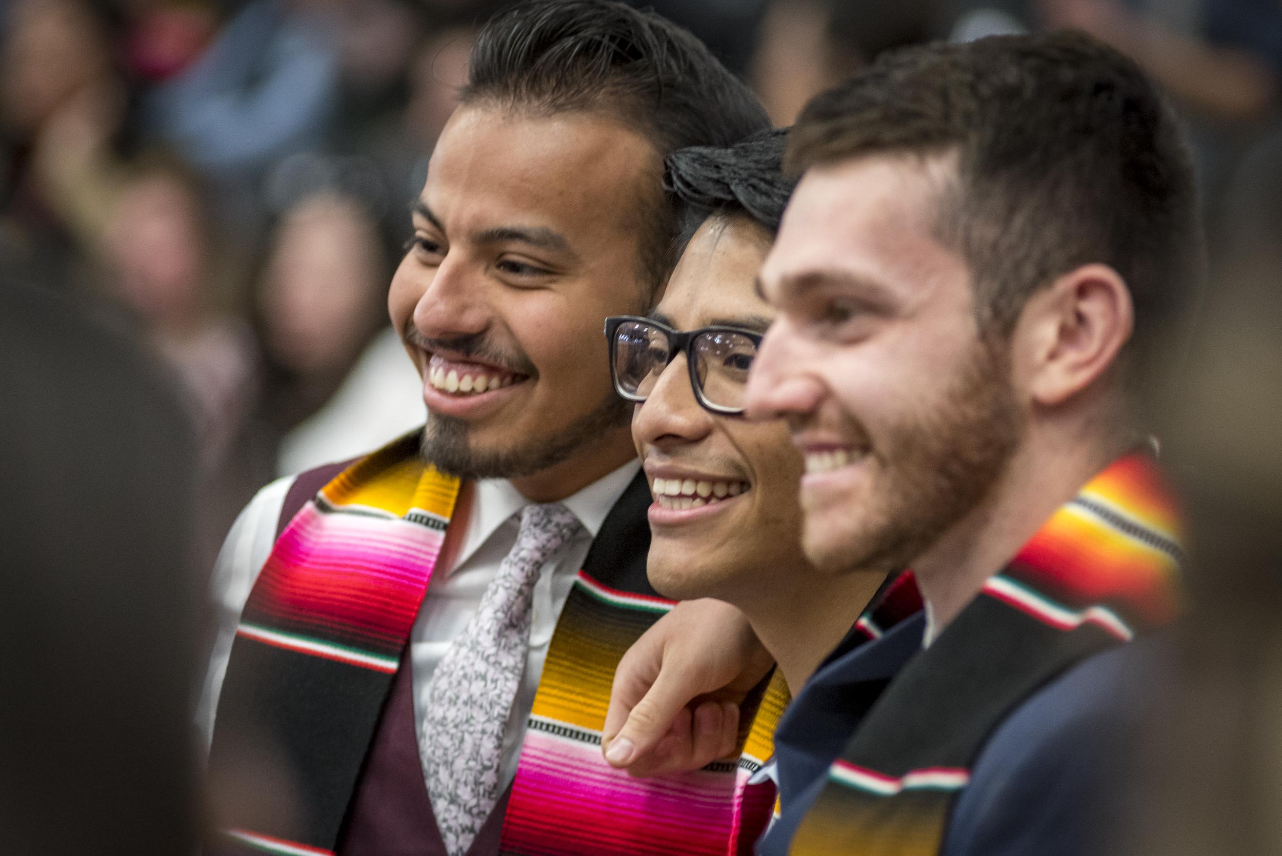 Three graduates smiling at the MSU Denver Latinx Graduation Spring 2019