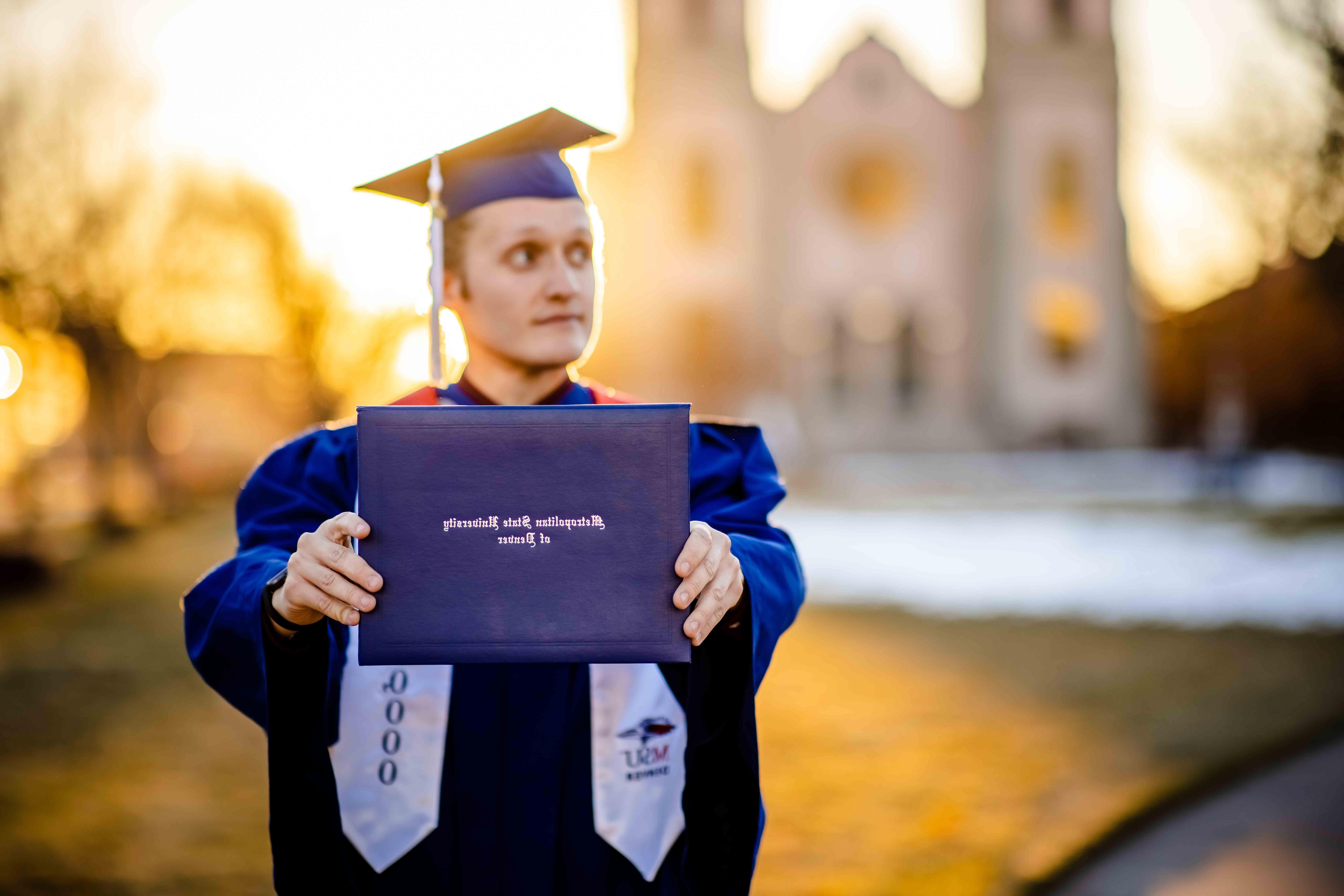Branden Ingersoll with his diploma cover